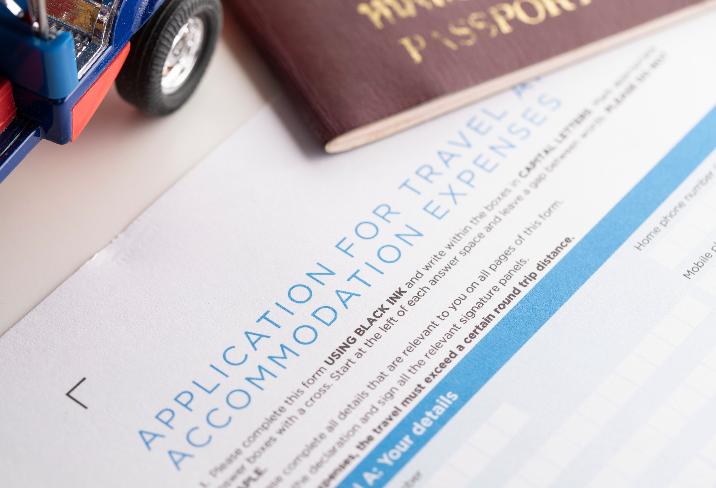 Travel Application Form And Passport On The Table Travel Application Form And Passport On The Table